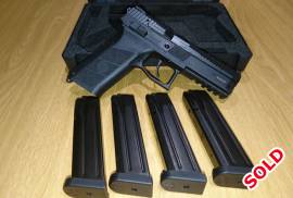 CZ PO9 9mmP, CZ PO9 9mm P. Shot less than 200 rounds.
Includes 4 magazines.