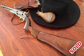 SOLD Rare 1860 Army Open Top with shoulder stock, Relive the cowboy era with this rare Colt open top replica which is in good working condition, with antique finish and has provisional cutouts and screws for the shoulder stock attachment, as well as a customized removable shoulder stock which turns it into a revolving carbine. Included is an original civil war era powder flask and an El Paso genuine leather holster. Reasonable offers will be considered. 