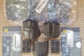 Aveen Ramshai , IMI Holster with 3 Extra Belt Loops and Retention Adjustable Double Magazine Pouch with Original Packaging and Allen Wrench Adjusting Tools R2750 for the Complete Set. Postage Included. Please Whatsapp me if interested. 