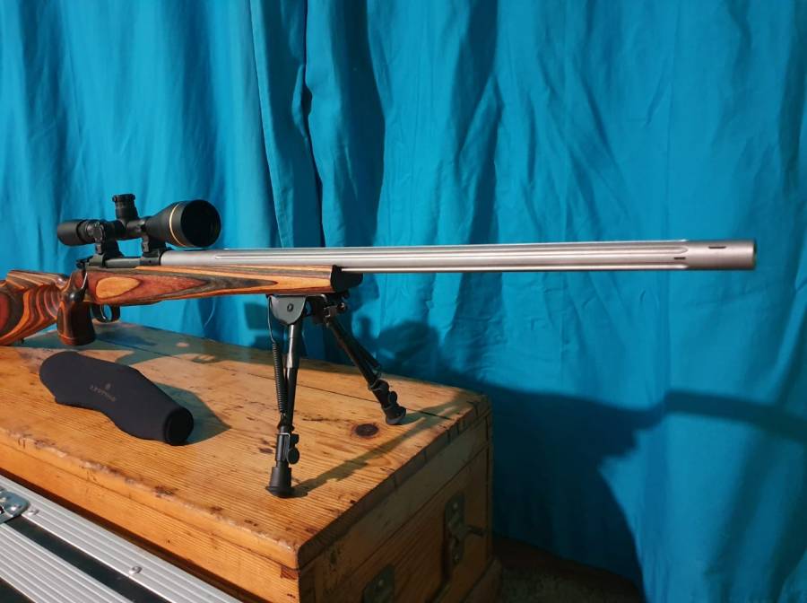 Rem Mag, Custom build in USA.
7mm Rem Mag Cz550 magnum action.
Laminate stock.
Leupold VX3 4.5-14x50 telescope with speed dials.
Lilja stainless steel barrel 27inch.
Straight taper 1.3 to 1.1
Fluted barrel with target crown and magna port for extra stability and reduced recoil. Rugged rifle case.