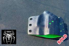 Custom kydex holster, Custom holster made by Critical carry solution.
tactical but practical, out side side carry with concealment.
Pssive retention

Tactical black with Toxic Green

Never been used