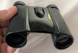 Nikon 10x25 Sports Star EX Binoculars, Lightweight binoculars with a slim, stylish body, 10x magnification, 25 mm objective lens and wide field-of -view. Multilayer-coated lenses provide bright, clear images, even in low-light. The body is covered with a rubber coating for a secure grip and they are compact enough to fit easily into a pocket or pouch. The perfect travel companion, this model is ideal for a range of activities, including trekking, nature watching and sporting events. Wide field-of-view Waterproof (up to 2 m for 5 minutes) and fog-free with O-ring seals and nitrogen gas for added resistance to the elements. Multilayer-coated lenses deliver superior light transmission for bright, clear images with well-balanced color. Close-focusing distance of only 3.5 m. Turn-and-slide rubber eyecups with multi-click system make it easy to position your eye at the correct eyepoint. Eco-glass optics, free of lead and arsenic, are used for all lenses and prisms.