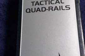 UTG Quad Tail for Galil, Quad Tactical rail and front grip for a Galil rifle.
Has 4 Picatiny rails to fit many accessories. 