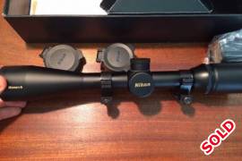 Nikon monarch 4-16x42, Very nice scope. 25mm tube with side parallax adjustment, Nicoplex reticle, semi tactical turrets under screw on caps and flip up lens covers. (Note I recently misplaced the sunshade).